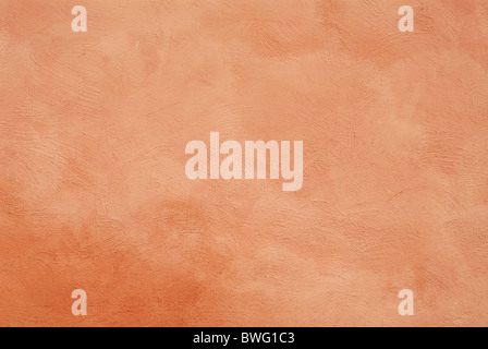 close up detail of rustic textured terracotta stucco wall Stock Photo