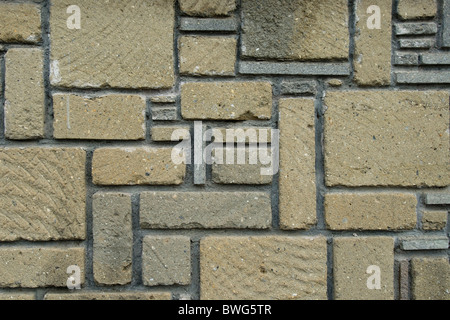 close up detail of brick wall made up of irregular rectangular blocks Stock Photo