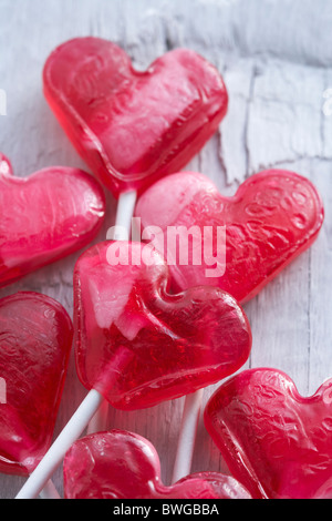 Red heart-shaped lollipops Stock Photo