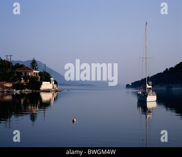 A yacht moored in Vathi Harbour on the Greek island of Meganissi Stock Photo