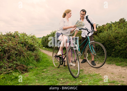 Couple on bicycle trip check route Stock Photo
