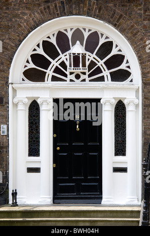 Ireland, County Dublin, Dublin City, Ornate black and white Georgian doorway in the city centre south of the Liffey River. Stock Photo