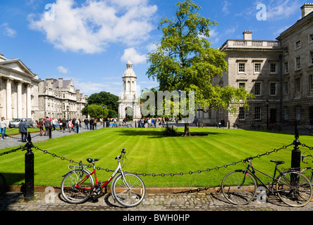 Ireland County Dublin City Trinity College university with people walking through Parliament Square towards Campanile Stock Photo