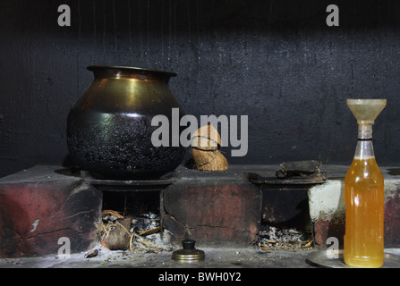 Old Indian cooking vessels in kitchen Stock Photo