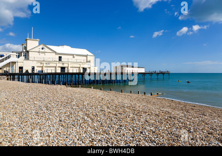 England West Sussex Bognor Regis Pier with people fishing off the end and the shingle pebble beach with people in canoes Stock Photo