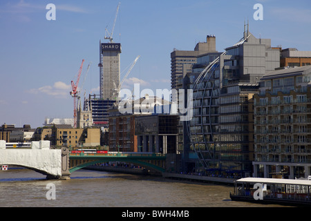 South bank of the river Thames with the Shard being built in the background, London Stock Photo