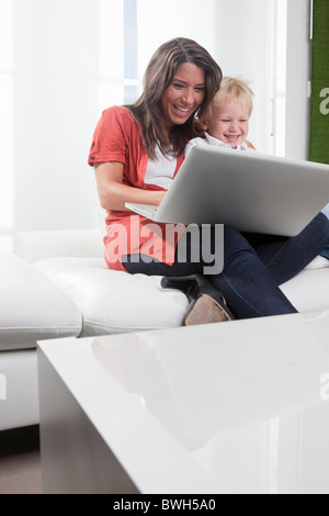 Mother and son using laptop Stock Photo