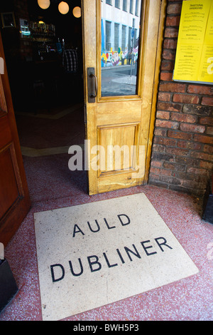 Ireland, County Dublin, Dublin City, Entrance door to the Auld Dubliner pub in Temple Bar with the name written on the ground. Stock Photo