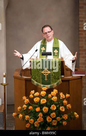 Anglo male pastor delivers sermon from the pulpit during Sunday service at St. Martin's Lutheran Church in Austin, Texas, USA Stock Photo