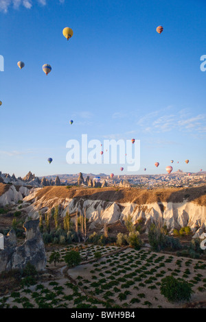 Aerial photo of Multitude of Hot air balloons in flight over Goreme National Park, Cappadocia Anatolia Turkey pt 101757 Turkey Stock Photo