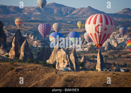 Aerial photo of Multitude of Hot air balloons in flight over Goreme National Park, Cappadocia Anatolia Turkey land 101778 Turkey Stock Photo