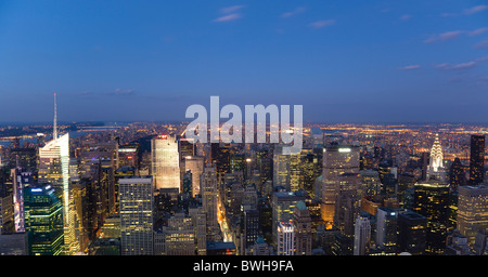 USA, New York, Manhattan, View from Empire State building over midtown skyscrapers with Art Deco Chrysler Building at sunset Stock Photo