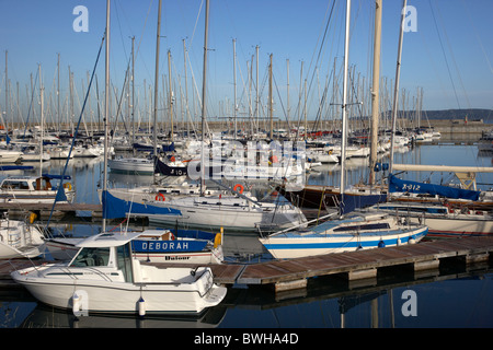 yachts and boats in the royal irish yacht club in howth harbour and marina dun laoghaire dublin republic of ireland Stock Photo