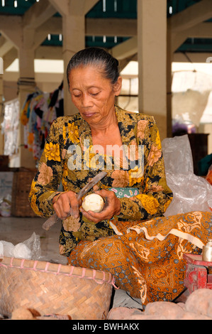 Farmwoman selling batatas on a weekly market near Yogyakarta, Central Java, Indonesia, Southeast Asia Stock Photo