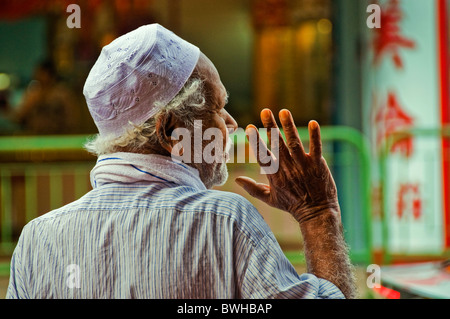 Portrait of Indian man standing in doorway in Singapore Little India Stock Photo