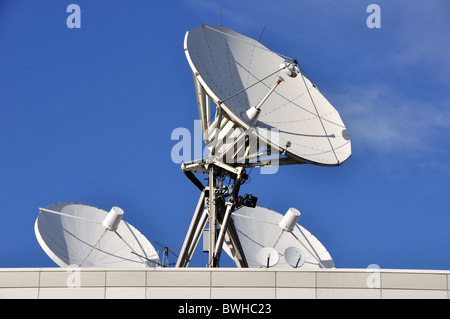 Satellite Communications Dishes on a Roof Stock Photo