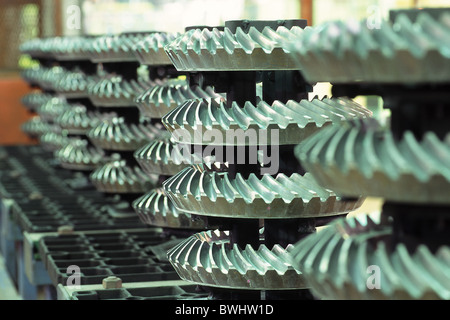 gearwheels bevel wheels steel metal gear transmission mechanics power transmission industry production achiev Stock Photo