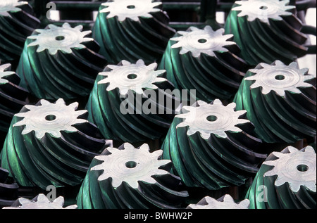 gearwheels bevel wheels steel metal gear transmission mechanics power transmission industry production achiev Stock Photo