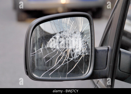 rear-view mirror side mirror broken splinter shards glass defective damage harm collision car automobile p Stock Photo