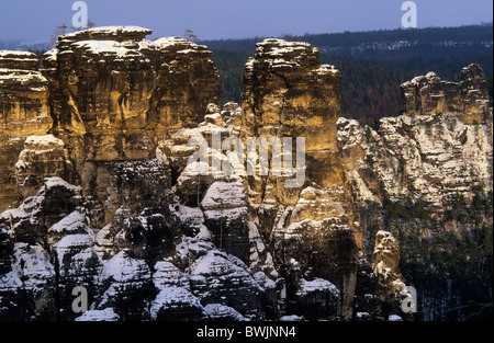 Europe, Germany, Saxony, Elbe Sandstone Mountains, Saxon Switzerland, snow covered Felsenburg Neurathen Stock Photo