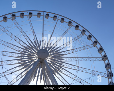 Ferris wheel over blue sky Stock Photo