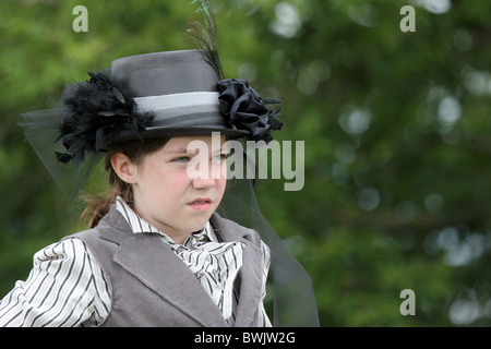 A young girl dressed in western vintage clothing Stock Photo