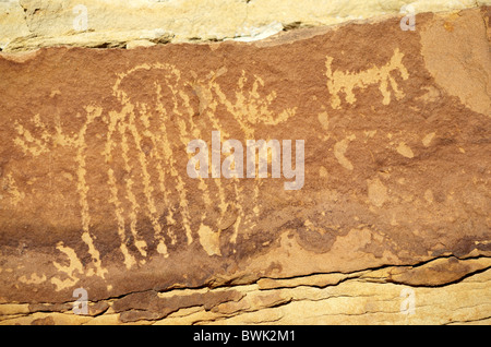 Native Maerican Indian petraglyphs on a rock face near Thermopolis in Wyoming, United States of America Stock Photo