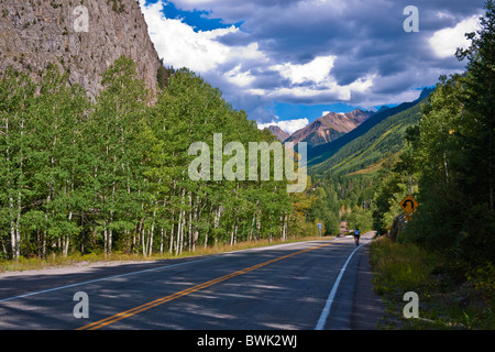 Cyclist on the San Juan Skyway (Highway 145) near Ophir, Uncompahgre National Forest, Colorado Stock Photo
