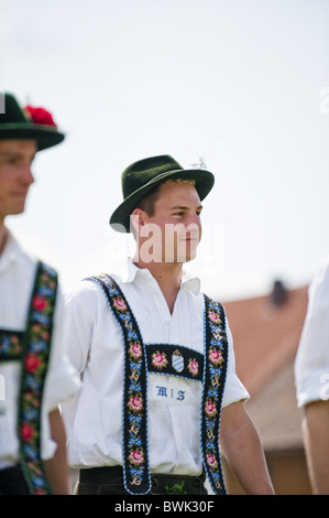 Young men wearing traditional costumes, May Running, Antdorf, Upper Bavaria, Germany Stock Photo