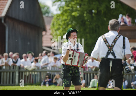 Accordionist wearing traditional costume, May Running, Antdorf, Upper Bavaria, Germany Stock Photo