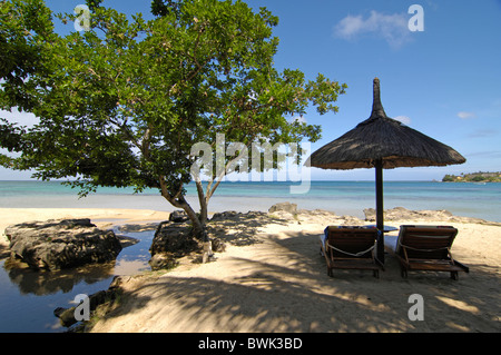 Mauritius hotel Maritim Balaclava Turtle Bay beach seashore beach lying sunshade beach Indian ocean deck cha Stock Photo