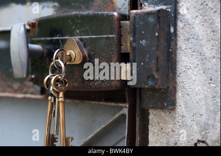 Keys in Old Metal Door Lock Stock Photo