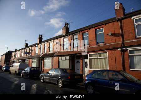 row of 2up 2down modernised victorian red brick terraced houses in manchester uk Stock Photo