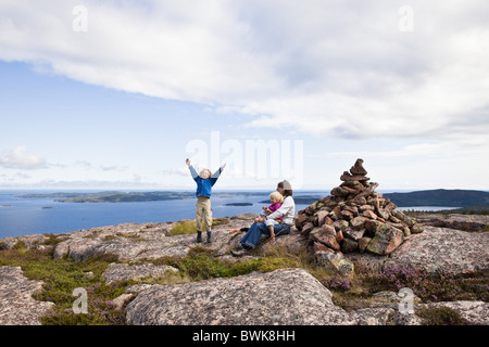 A woman and two girls on rocks at the national park Skuleskogen, Hoega Kusten, Vaesternorrland, Sweden, Europe Stock Photo