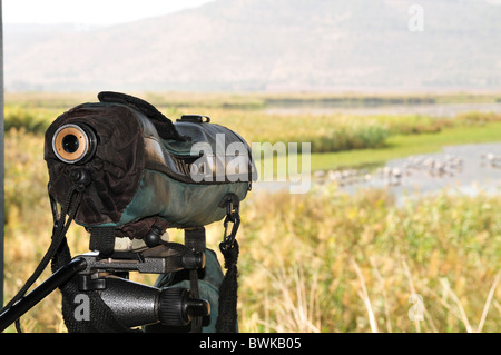 Israel, Hula Valley, Lake Agamon Bird sanctuary nature reserve Bird watcher's telescope overlooking the lake from within a hide Stock Photo