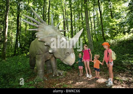 family group children dinosaurs Prehistorical park Reclere Canton Jura Switzerland Europe excursion experie Stock Photo
