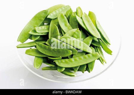 Pea pods, snow peas in a glass bowl Stock Photo