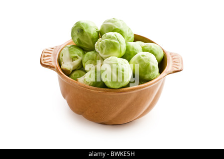 brussels sprouts in bowl on white background Stock Photo