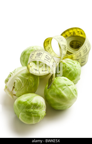 brussels sprouts with measuring tape on white background Stock Photo