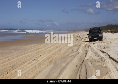 Australia, Queensland, Fraser Island, Recreational Vehicle Driving on the Sandy Beach Stock Photo
