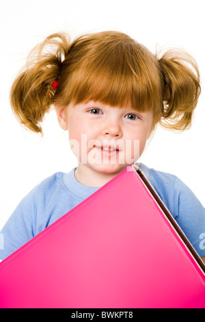 Portrait of small girl with textbook on a white background Stock Photo