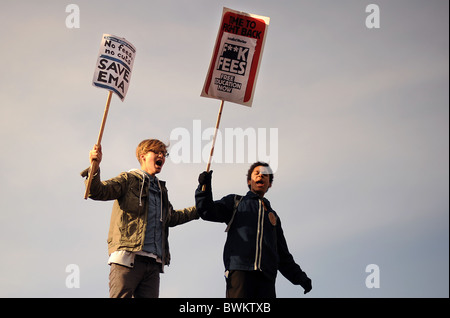 Students hold placards during a demonstration in Trafalgar Square Stock Photo