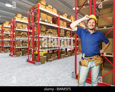 happy manual worker in classic warehouse 3d background Stock Photo