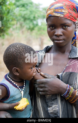 A young mother breastfeeding her baby Central African Republic Stock ...