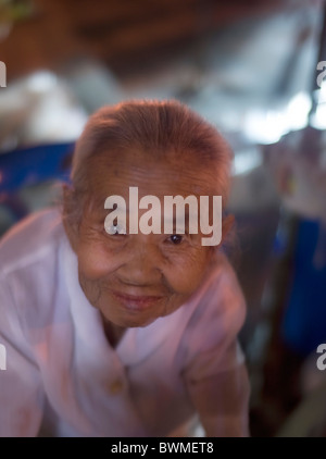 old flower seller in Thailand Stock Photo