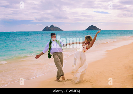 newly wed couple on the beach at Lanikai, Hawaii Stock Photo