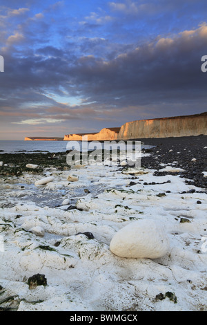 An early winter sunrise lights up the cliffs of the Seven Sisters at Birling Gap, near Eastbourne, East Sussex, England. Stock Photo