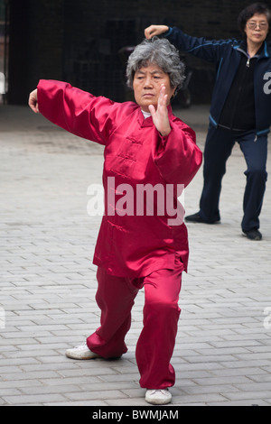 Chinese woman performing tai chi, Xi’an, China Stock Photo