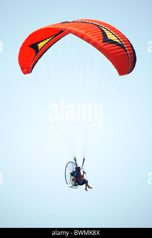A powered para glider against a clear blue sky. Stock Photo