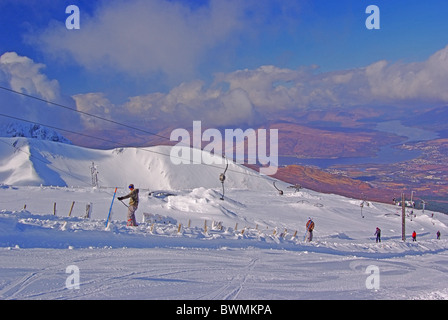 UK Scotland Lochaber Inverness-shire Skiing and Snowboarding Aonach Mor Fort William and mountain of Carn More Dearg Stock Photo